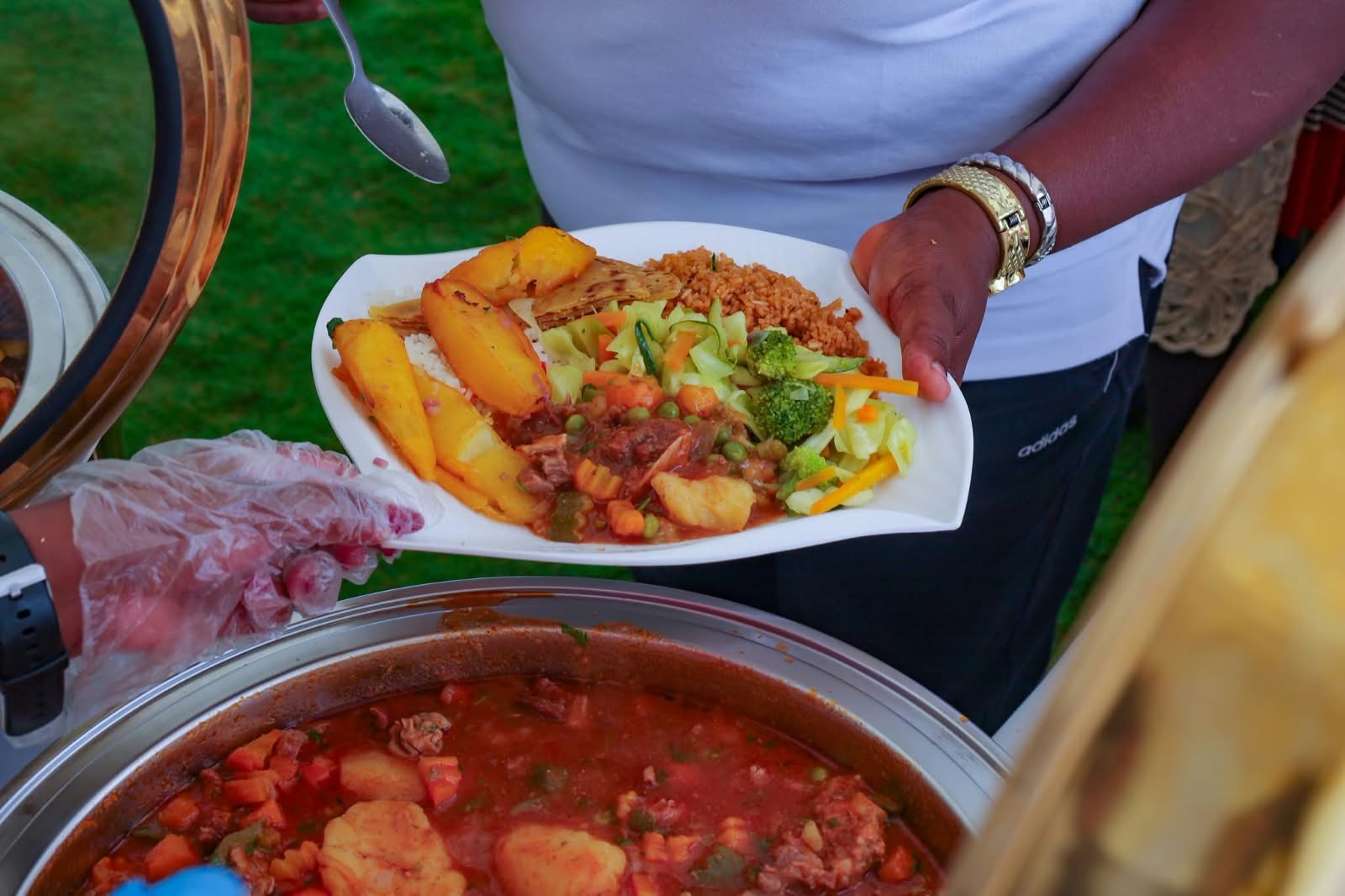 A plate of food being served from the buffet
