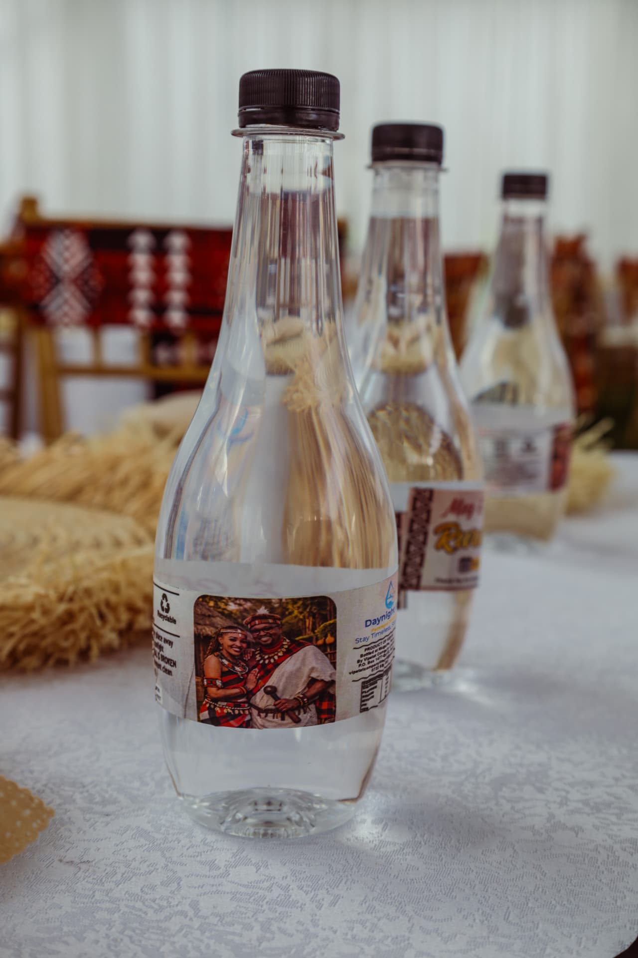 Daynight Blues bottle with a traditional wedding photo label on a lace-covered table